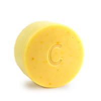 Citrus Shine conditioner bar for curly hair scented with orange bergamot and litsea cubeba essential oils contains calendula chamomile and turmeric all natural colour